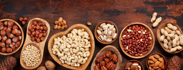 Various nuts selection on wooden table