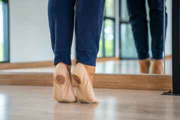  Confidence Caucasian male ballet dancer practicing ballet dance alone in studio room. Handsome man athletic dancing classic ballet showing performance body stretching and strength muscle.
