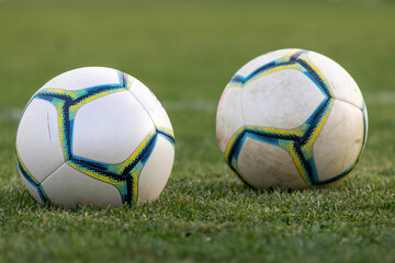 Fototapeta na wymiar Soccer or football ball on a grass