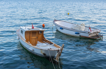 boats moored to the sea shore