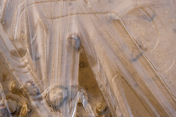 Ice pattern on a sandy beach