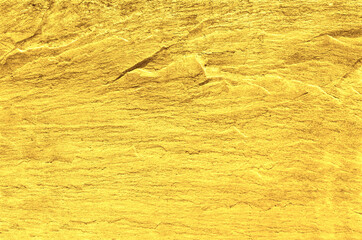 Gold grunge background. Gold stone background with copy space.