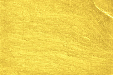 Gold grunge background. Gold stone background with copy space.