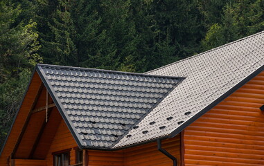 roof covered with metal tiles, roofing, wooden house