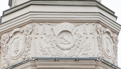 Themed sculptural murals decorating the walls of buildings. Bas-relief on the wall.