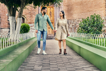 Young Latino male and female couple in love between 25 and 35 years of age