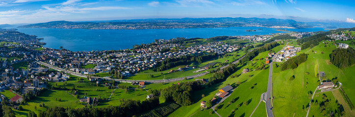 Fototapeta na wymiar Aerial view of the city Pfäffikon Freienbach in Switzerland on a sunny afternoon.