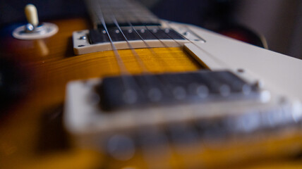 Fototapeta premium Strings and switch of classic brown and black electric guitar