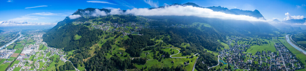 Fototapeta na wymiar Aerial view of the city Triesen in Liechtenstein at the swiss border on a sunny day in summer. 
