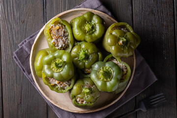 Green bell peppers stuffed with meat, rice and vegetables. Tasty food. 