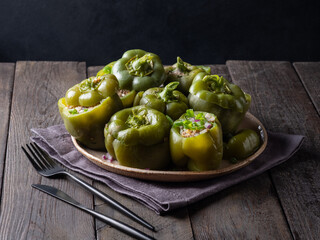 Green bell peppers stuffed with meat, rice and vegetables. Tasty food. 