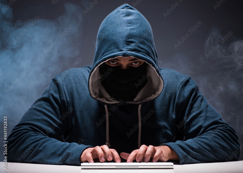 Aufkleber computer hacker working in dark room