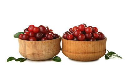 Bowls of ripe cranberries on white background