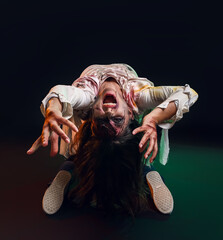 Scary zombie woman on dark background