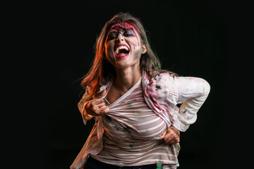 Scary zombie woman on dark background