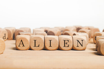 Aliien Word Written In Wooden Cube