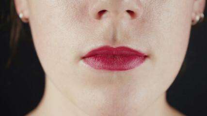 Close-up photo of woman with red lips