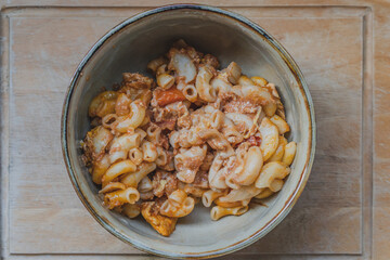 Stir fried macaroni pasta with tomato sauce, pork and egg is famous food. 