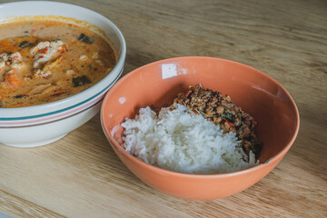 Stir fried pork with basil on topped boiled rice is popular thai style street food and spicy prawn soup.