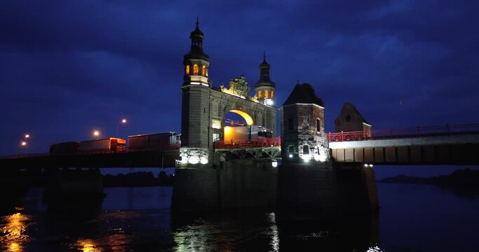 Illuminated Queen Louise Bridge in Sovetsk at dusk