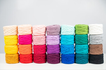 Rows of multicolored cotton yarn. The assortment of the store for needlework.