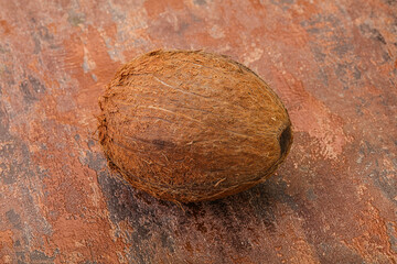 Tropical brown coconut over background