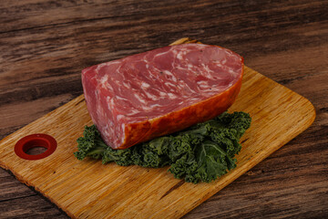 Beef ham piece over board