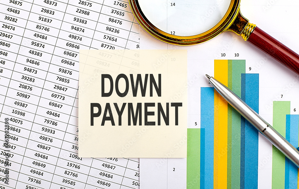 Poster business concept. top view of stiscker with text down payment on the chart background
