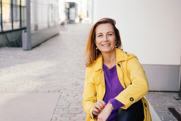 Happy motivated middle-aged woman with a vivacious smile