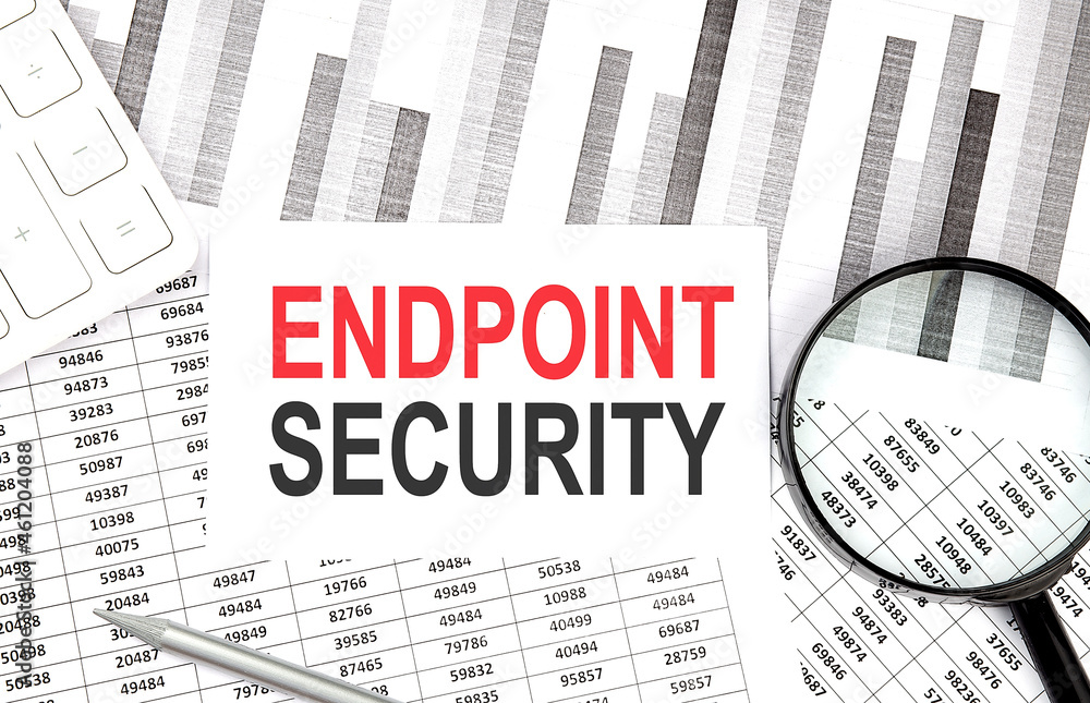 Poster endpoint security text on paper with calculator,magnifier ,pen on graph background