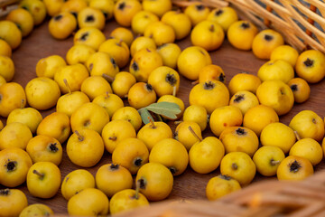 Close up of fresh ripe yellow hawthorn fruits, forest fruits.