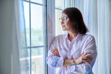 Portrait of a mature confident woman looking out the window
