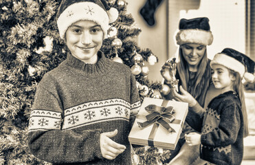 Modern Christmas family celebrating holidays at home