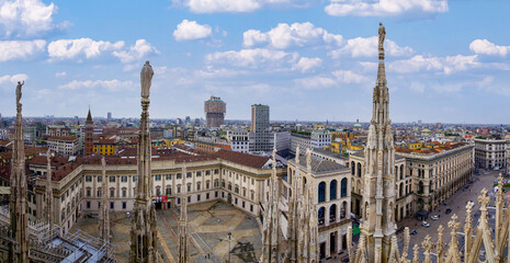 Overview of the Milan Cathedral seen from above. Duomo of Milan at sunset and in daylight.