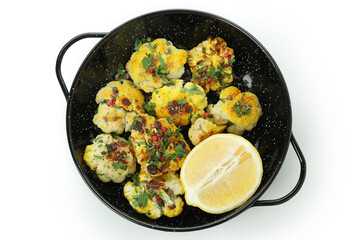 Bowl with baked cauliflower and lemon isolated on white background