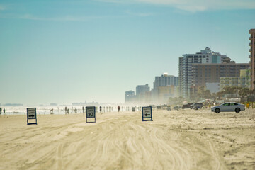 Fototapeta na wymiar Daytona Beach street signs along the shoreline on a sunny winter day.