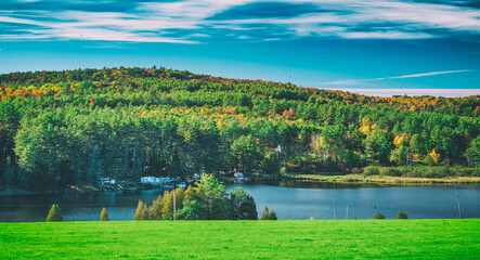 Fototapeta na wymiar Ticklenaked Pond in foliage season, New Hampshire - USA.