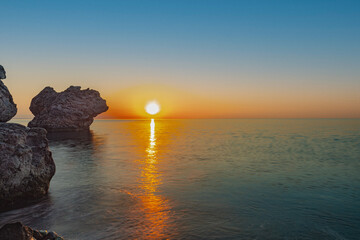 rocky coast of the mediterranean sea at dawn