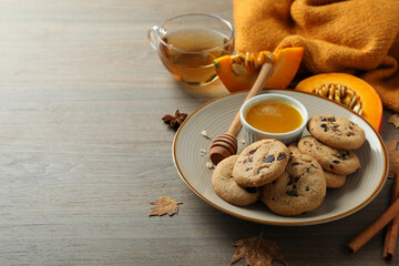 Concept of tasty food with pumpkin cookies, space for text