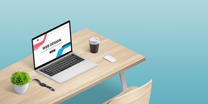 Web design studio concept with laptop computer on desk in isometric position. Copy space beside