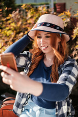 Fototapeta na wymiar girl with hat in park
