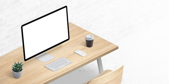 Computer display mockup on office desk in isometric position. Copy space beside