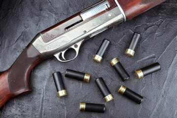 hunting rifle and cartridges on a black background top view studio photo shot