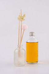 A bottle of fragrant oil diffuser with Reed sticks, isolated on white background