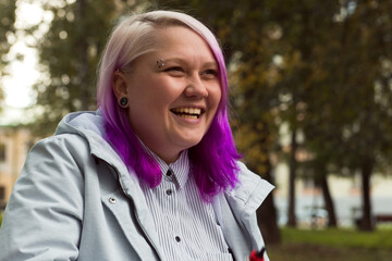 beautiful laughing lgbt woman colored hair portrait outdoor