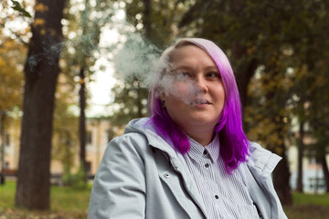 smoking lgbt woman colored hair portrait outdoor