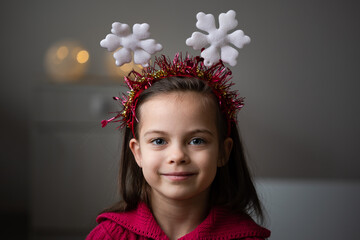 Portrait of little girl in New Year headband	