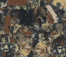 granite with small black and orange blotches, close-up of polished natural stone surface. Background, pattern, texture.