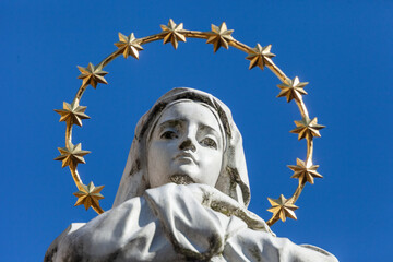 Sculpture of the Mother of God with a golden halo and stars on her head