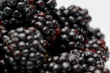 Ripe fresh blackberries, an abstract background of blackberries. Top view. Close-up. Macro. Blackberry berries with water drops. Flat lay. Useful forest fruits. Super food. Concept of healthy eating
